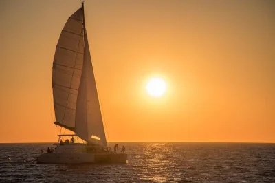 Feel the breeze on a santorini catamaran cruise, swim at red & white beaches, enjoy bbq lunch with open bar, and relax with hotel pickup included.
