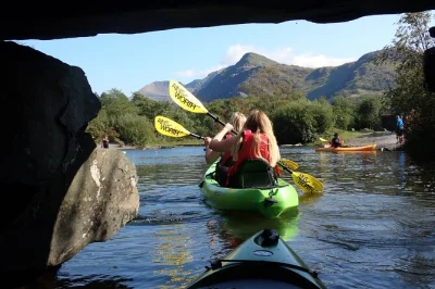 Feel the calm of snowdonia from a kayak on llyn padarn, spot slate mines & castles, and try a wild swim—guided adventure with all gear included.