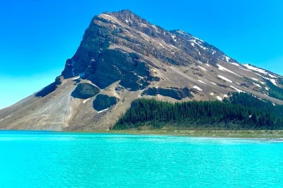 Feel the chill of glacier-fed lakes, stroll moraine’s blue shore, and hear stories from a local guide on this lake louise & icefields parkway tour with pickup.