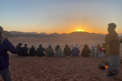 Experience a wadi rum jeep tour, local dinner, and stargazing overnight. explore rock bridges, red sand dunes, and ancient sites in jordan’s desert.