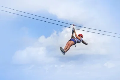 Feel the rush on a san juan ziplining tour at hacienda campo rico, just minutes from the city. includes safety gear, certified guides, and ends at a hilltop mojito bar.