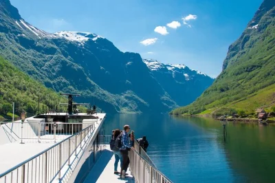 Feel the mist of nærøyfjord, explore a living viking village, and ride the steep flåm railway on this norway day trip with local guide and all transport included.