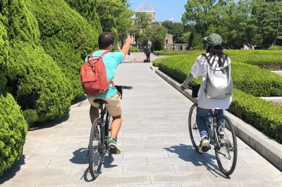 Pedal hiroshima’s riverside paths, pause at peace memorial park, visit the atomic bomb dome & shukkeien garden with a local guide. includes bike & helmet.