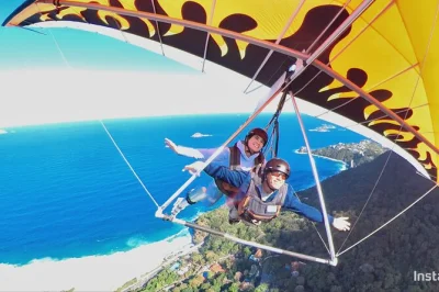 Feel the rush of hang gliding over rio de janeiro with a champion pilot, launch from tijuca forest, spot christ the redeemer, and land on são conrado beach. includes gopro video.
