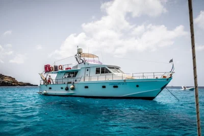 Feel the mediterranean breeze on a lampedusa day boat tour with stops for swimming, snorkeling at rabbit beach, and a homemade seafood lunch served onboard.