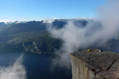 Feel the edge at preikestolen on a guided hike from stavanger, with hotel pickup, private guide, and all transport included. experience norway’s wild fjord scenery up close.