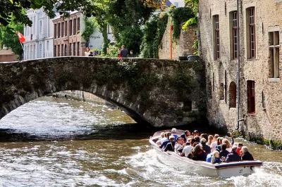 Wander bruges’ canals by boat, stroll cobbled alleys, taste belgian chocolate, and explore the markt with a local guide. includes map and city highlights.