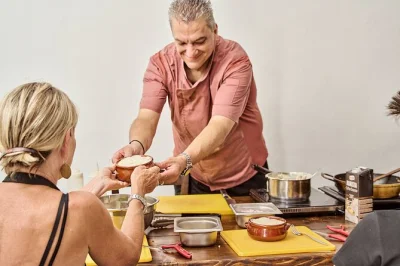 Feel the warmth of santorini as you cook classic greek dishes, share laughs with a local chef, and enjoy santorinian wine. includes hands-on class and lunch.