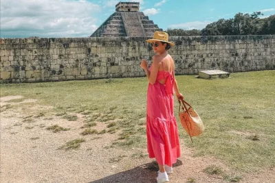 Feel the energy of chichen itza, swim in cenote ik kil, and wander yellow streets in izamal on this day trip from merida with guide, buffet lunch & transport.