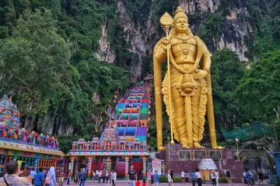Feel the buzz of kuala lumpur’s suburbs, climb batu caves’ 272 steps, meet playful monkeys, and watch batik artists at work—includes hotel pickup and local guide.