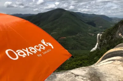 Feel the mist at hierve el agua, hike with locals, then sample mezcal at a real oaxacan distillery. includes entry and free tastings, transport from oaxaca.