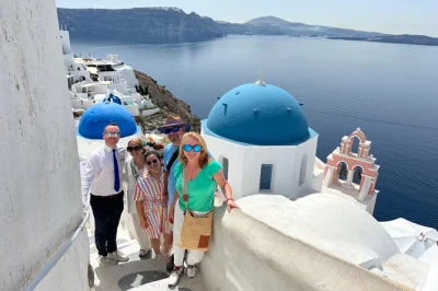 Start your santorini day with hotel pickup, see oia’s blue domes, wander pyrgos castle, explore akrotiri ruins, and relax at red & black beaches—all with a local guide.