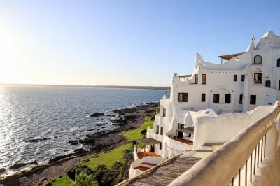 Feel the sea breeze in punta del este, wander casapueblo’s terraces, see la mano sculpture, and stroll gorlero avenue. small group tour with local guide included.