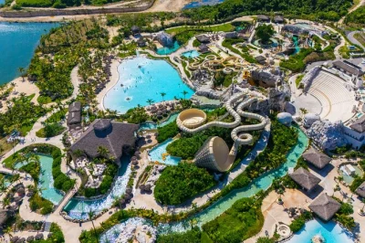 Chase thrills at el dorado water park in punta cana with over 20 attractions, lazy river, wave pool, and private beach. includes hotel pickup and entry ticket.