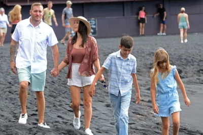 Wake up to kona coffee aromas, walk punaluʻu black sand beach, explore volcanoes, and end at rainbow falls. includes pickup, lunch, and local guide.