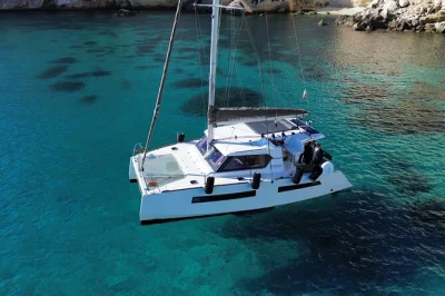 Feel the breeze off cagliari’s coast on a catamaran tour with snorkeling, local stories, and a prosecco toast. includes crew, equipment, and city pickup options.