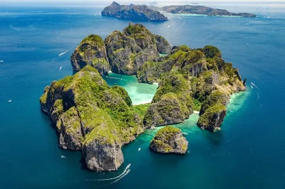 Swim at maya bay, snorkel viking cave, see monkeys at monkey beach, and relax on khai island—all with lunch and phuket hotel pickup included.