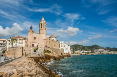 Feel ancient stones under your feet in tarragona, wander sitges’ seaside streets, and relax on san sebastián beach—all with hotel pickup and a small group guide.