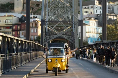 Feel the pulse of porto & gaia on a private tuk tuk ride—explore narrow streets, iconic bridges, and riverside neighborhoods with a friendly local guide. includes pickup.