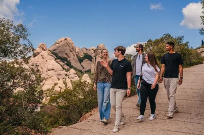 Feel the spirit of montserrat with a guided monastery visit, black madonna viewing, and a nature walk—includes transport from barcelona and small group access.