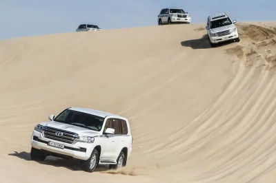 Feel the rush of qatar’s sealine desert with dune bashing, camel rides, and a stop at khor al adaid. includes pickup from hotel or cruise terminal.