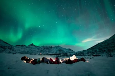 Step into arctic night near tromsø, chase the northern lights with a local guide, warm up by a campfire, enjoy homemade vegan soup, and get free souvenir photos.