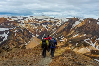 Feel the wild side of iceland on a small group landmannalaugar day hike from reykjavík, trekking rainbow mountains and soaking in natural hot springs. pickup available.