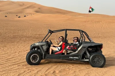 Feel the thrill of dubai’s desert with quad biking, dune bashing, camel rides, and a middle eastern dinner show. includes hotel pickup and table service.