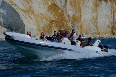 Feel the spray of the sussex sea on a seven sisters boat trip with local guides, wildlife spotting, and stories from newhaven to cuckmere haven. includes life jackets.