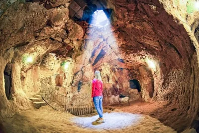 Feel the cool air of derinkuyu underground city, wander ihlara valley’s riverside paths, and share a local lunch—all with hotel pickup and a small group guide.