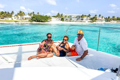 Sail aruba’s coast on a premium catamaran with open bar, fresh lunch served to your seat, and two top snorkeling stops—includes pickup by shuttle and local crew guidance.