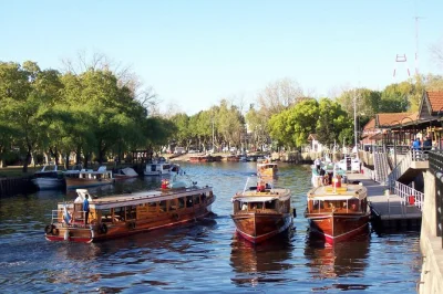 Feel the rhythm of tigre delta on a small-group boat tour from buenos aires, with empanadas at a riverside club, local guide, and hotel pickup included.