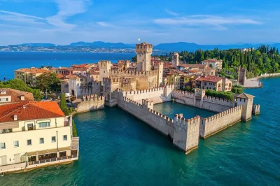 Feel the romance of verona, stroll sirmione’s lakeside streets, and cruise lake garda—all in one day from milan. includes boat tour, guide, and transport.