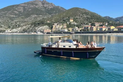 Feel the breeze as you cruise cinque terre by boat—monterosso to riomaggiore—with local snacks, drinks, and swim stops. small group tour with lunch included.