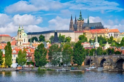 Ride from vienna to prague for a day of castle walks, the astronomical clock, charles bridge stories and lively squares. includes hotel pickup & local guide.