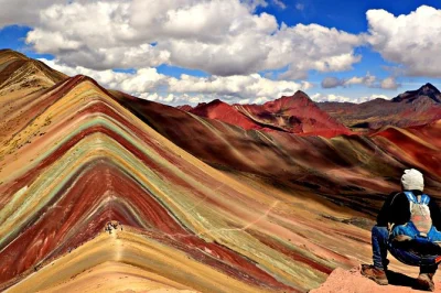 Feel the andes on a small group day trip to rainbow mountain from cusco, with breakfast, lunch, and local guides. includes hotel pickup and all transport.