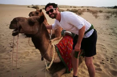 Ride camels through rajasthan’s dunes, visit kuldhara village, watch the sunset, and enjoy local dinner. includes snacks, bottled water, and return transfer.