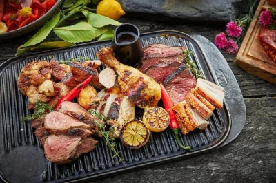 Share a lakeside bbq dinner at walter peak farm with cruise from queenstown, farm show, and local flavors. includes return boat ride and buffet meal.