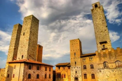 Feel the medieval spirit of tuscany on a small-group day trip from siena to san gimignano, volterra & monteriggioni. includes farm lunch, local guide & transport.
