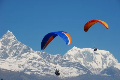 Book a pokhara paragliding adventure with pickup. soar above sarangkot, see annapurna, machhapuchhre & fewa lake. includes photos & video.