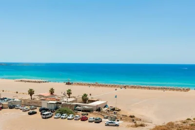 Wake up to pink sands at elafonisi, swim at falasarna, and taste olive oil in vouves. includes snacks, air-conditioned transport, and a local guide for a relaxed booking.