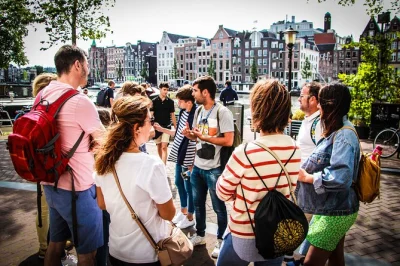 Step into amsterdam’s heart with a small-group walking tour, from dam square to the red light district. includes local guide, canal cruise option, and personal stories.