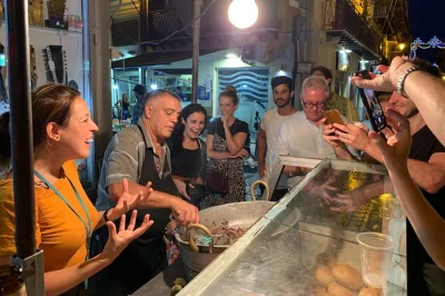 Walk palermo’s lively streets at night, taste real sicilian street food at vucciria market, hear local legends, and share a meal with a palermitan guide—includes drinks.