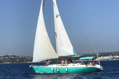 Feel the sea breeze on a private rhodes cruise with lunch, drinks, and stops at anthony quinn bay, kallithea springs, and ladiko beach. includes snorkel gear.