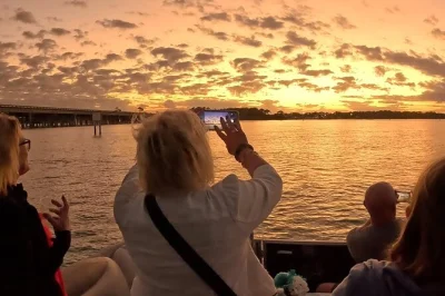 Watch destin’s sunset from a patio-style pontoon, sip wine, spot dolphins, and cruise the harbor lights with a local captain. includes snacks and blankets for comfort.