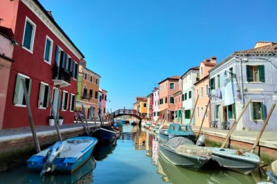 Feel the colors of burano and watch murano glassblowers at work on this venice islands day trip, with private boat, local guide, and a glass of wine included.