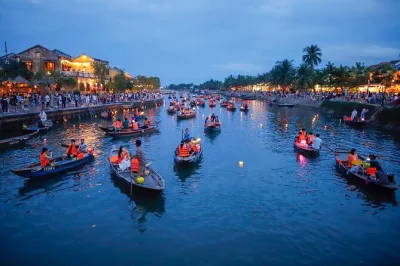 Step into marble mountains’ caves, taste hoi an’s street food at dusk, and wander lantern-lit alleys—includes hotel pickup, dinner, and local guide.
