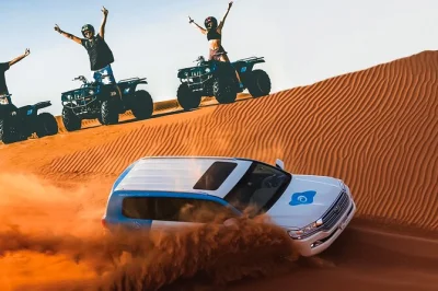 Erlebe dubais wüste hautnah mit dune bashing, quadfahren, sandboarding und kamelreiten. inklusive hotelabholung, erfrischungen und lokalem guide.