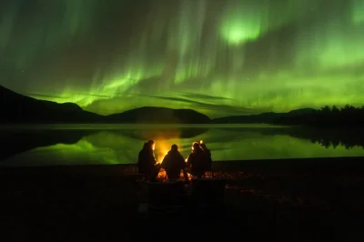 Feel the magic of tromsø’s arctic night on a small group northern lights tour, with fire-grilled sausage, hot drinks, and included photos. pickup and expert local guide.