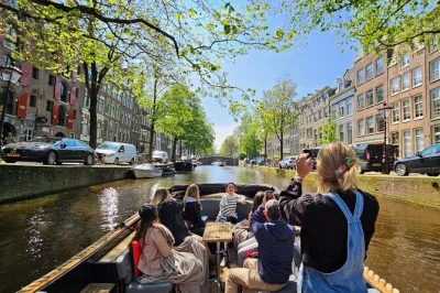 Float past amsterdam’s canal houses, bridges & landmarks on a 90-minute small group open boat tour with local guide. includes blankets, rain canopy & drinks for purchase.